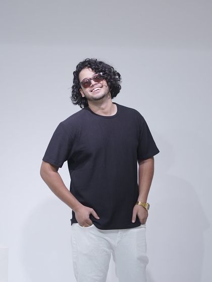 A final smiling shot from the studio session, capturing my easygoing personality.