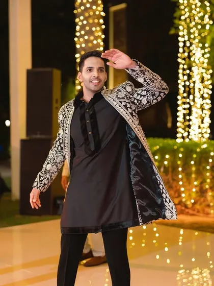 A groom looking sharp and confident during his solo performance. We help you own the stage.