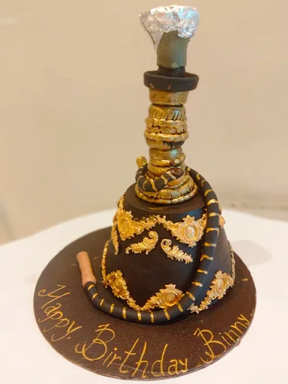 This intricate 3D Hookah cake was crafted with detailed golden accents and a realistic pipe. It's a chocolate truffle cake designed for a themed birthday celebration.