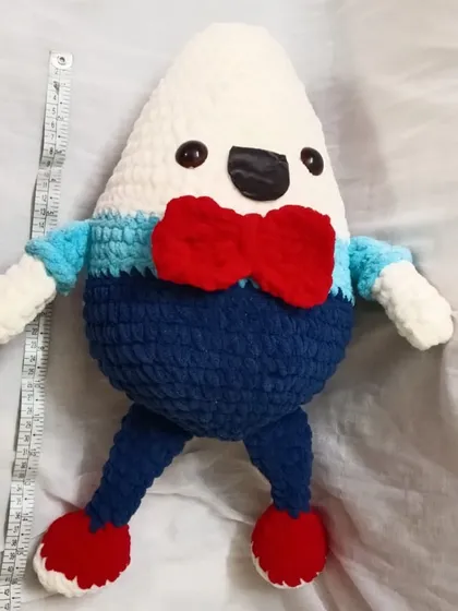 Another view of the large Humpty Dumpty, showing his full size next to a measuring tape.