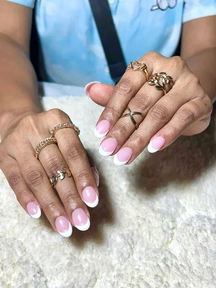 Another example of a beautiful, clean French manicure, showcasing this essential and popular service.
