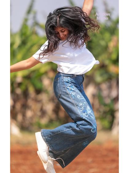 A slightly different angle of my jump, showing off the hand-painted jeans. It's amazing how a little paint can completely revitalize an old piece of clothing.