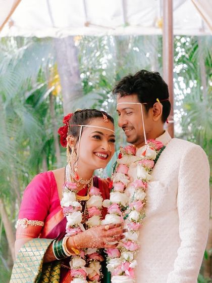A sweet, candid moment between the bride and groom. Her natural makeup enhances her joyful expression.
