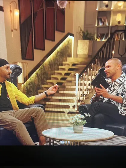 Another shot of Harbhajan Singh and Shikhar Dhawan during their conversation. The styling aimed to reflect their individual personalities while maintaining a cohesive look for the show.