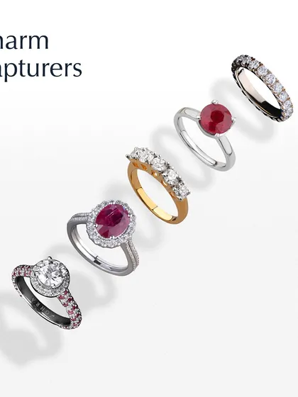 A collection of my Charm Capturer Rings. This image displays a variety of my custom ring designs, featuring radiant diamonds and vibrant rubies in both modern and classic settings, each telling a unique story.