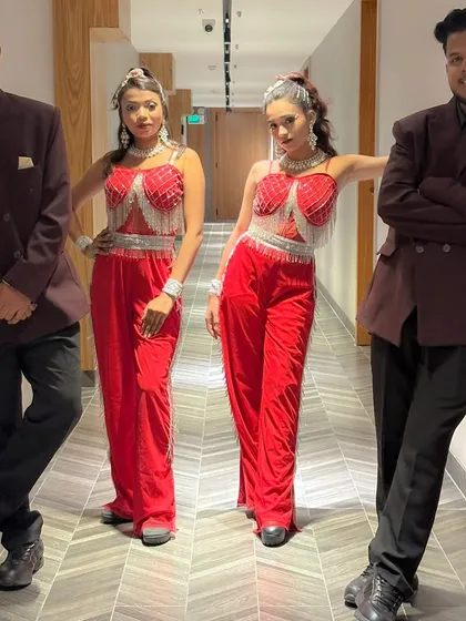 The full troupe in our striking maroon and red costumes. We pay close attention to our look to ensure it complements the theme and energy of the event.