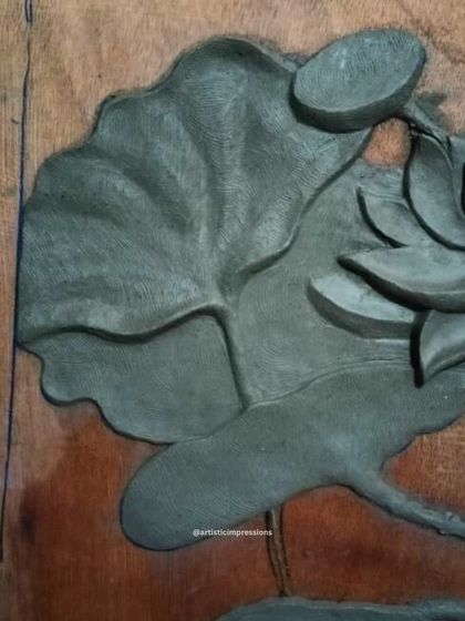 A close look at the texture of a lotus leaf in the clay sculpture stage. Every vein is carved by hand to create a realistic and tactile surface.