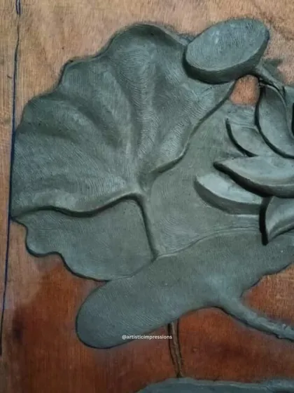 A close look at the texture of a lotus leaf in the clay sculpture stage. Every vein is carved by hand to create a realistic and tactile surface.