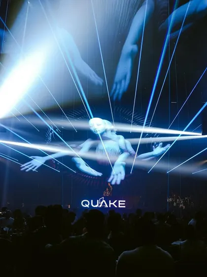 The futuristic, multi-armed visuals on the main screen at Quake create a sci-fi atmosphere during my set.