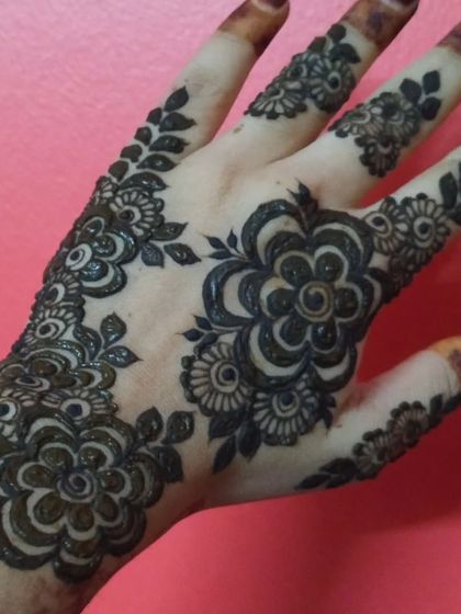 A bold and simple floral design created with thick, clean lines. This style is great for making a statement and results in a very dark, prominent stain.