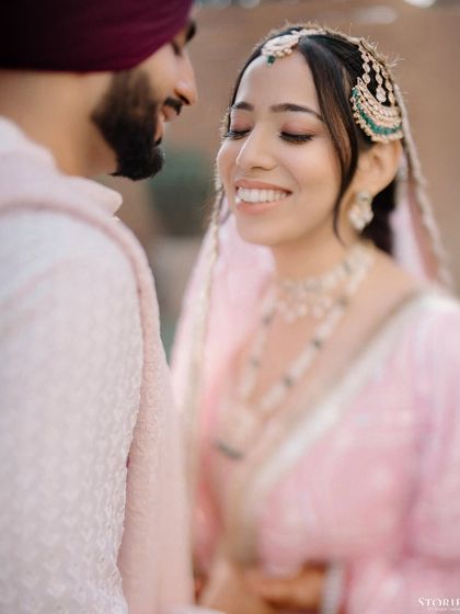 A soft and romantic close-up of Shelly and Shivam, her happy expression capturing the essence of the moment.