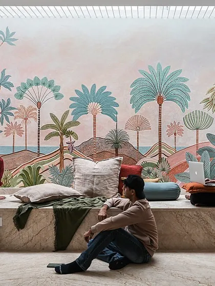 Art is what truly makes a space personal. I commissioned a local artist to create this stunning hand-painted mural for a large wall, turning a simple landing into the soul of the home. The built-in marble seating creates a multipurpose area for family to gather, read, or simply enjoy the view.