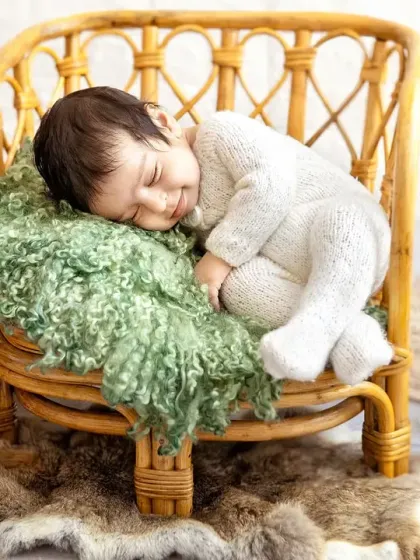 This pose shows just how tiny and curled up newborns are in their first few weeks. It's a classic and beautiful way to remember this stage.