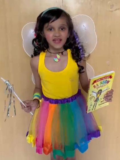 Dressed as a rainbow fairy, this student is ready for her "Share and Shine" moment. Costumes can be a wonderful tool to help children step into a role and speak with more confidence.