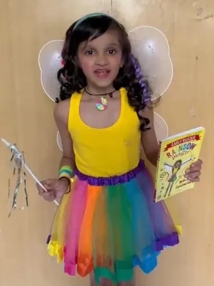 Dressed as a fairy, this student is ready for her "Share and Shine" presentation. We encourage creativity in all forms, and allowing kids to dress up makes speaking in class even more fun.
