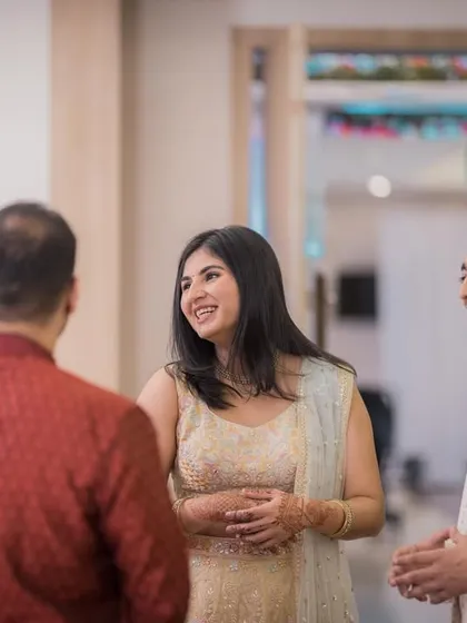 A moment of laughter and conversation between the couple and their guests.