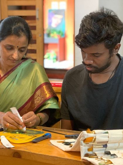A moment of shared learning between instructor and student. This personalized attention is what makes our "Gurukul" approach so effective for artists at every level.