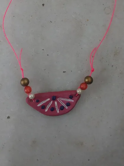 A beautiful clay pendant made for a school project. I guide students to create their projects themselves, as that is the best way to learn.