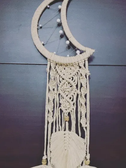 A full view of another version of the moon dreamcatcher, this one featuring a more complex central pattern.