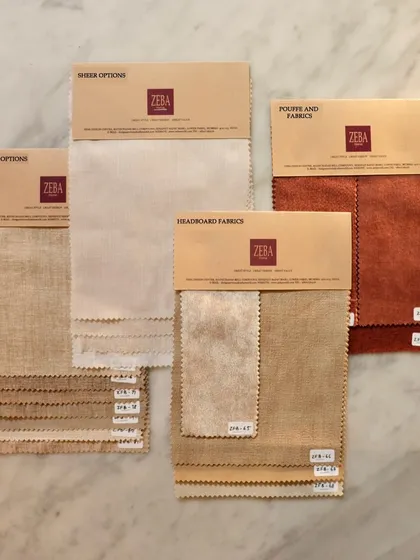 A behind-the-scenes look at fabric swatch selections for a client. I curate options for curtains, sheers, headboards, and upholstery, ensuring the textures and tones come together perfectly to bring a vision to life.