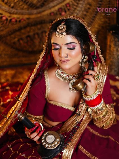 This close-up shot highlights the soft pink and purple eyeshadow, a modern twist on a traditional bridal look.