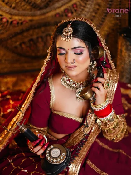 This close-up shot highlights the soft pink and purple eyeshadow, a modern twist on a traditional bridal look.