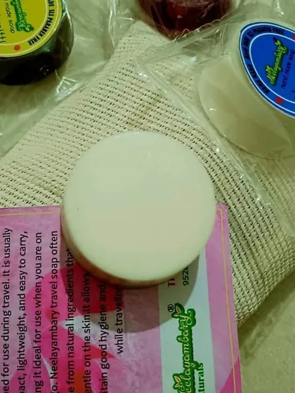 A close-up of the Shea Butter travel soap. These mini soaps are convenient, lightweight, and allow you to maintain your natural skincare routine wherever you go.