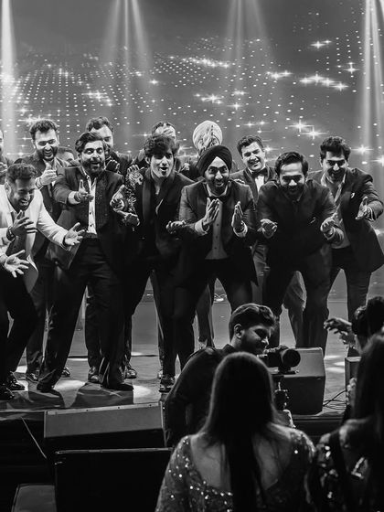 A classic groomsmen surprise for the bride. This black and white shot captures the fun and excitement of the moment perfectly.