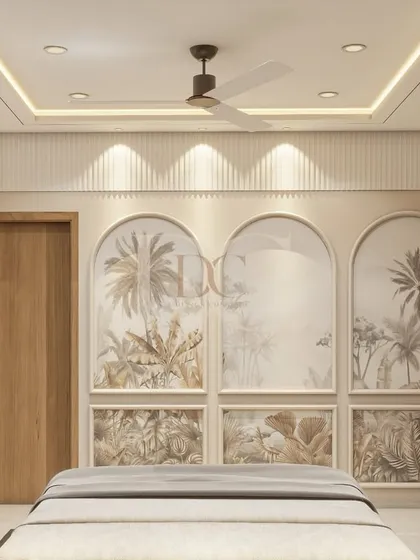 A serene bedroom design featuring arched panels with a subtle tropical wallpaper. The false ceiling with cove lighting and spotlights creates a soft, layered lighting effect perfect for relaxation.