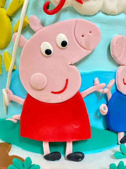 A close-up of the handmade Peppa Pig fondant figure. We pay attention to every little detail.