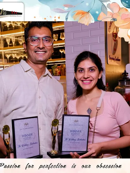 Our team members proudly displaying the winner's trophies from the Mpire Weddings awards.