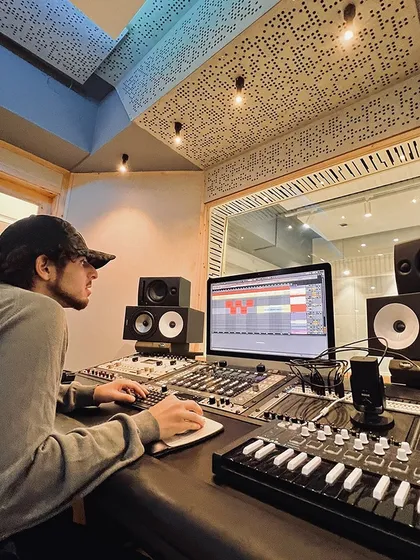 Another shot of a producer working on a track in our studio. The combination of top-tier gear and a focused environment leads to great results.