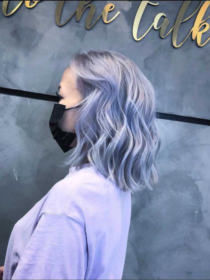 An ash hair transformation resulting in this beautiful, wavy, silver-blue lob. The color is unique, modern, and full of dimension.