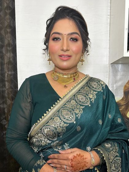 A beautiful, simple party look. The focus is on her glowing skin and a soft, elegant eye makeup that enhances her natural features.