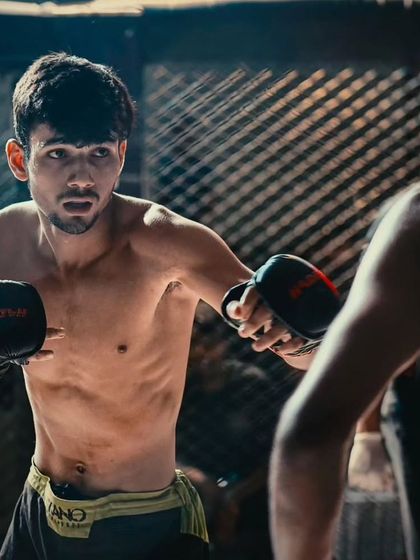 Built for battle. A focused shot of a fighter in his element, ready to exchange and dominate.