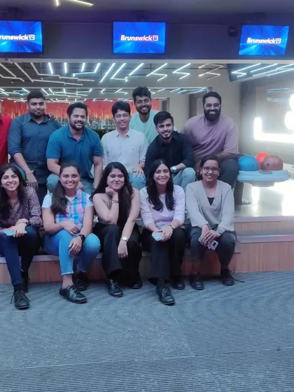 A happy group of friends posing for a photo after a fun day of gaming.
