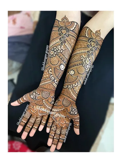 Another angle of this unique, non-symmetrical bridal design. You can see the detail in the floral work and the different textures created by lines, dots, and filled spaces.