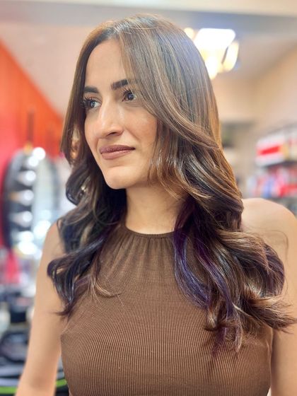 I may not be a magician, but I can make bad hair disappear. Here's a beautiful haircut and color I did for a client, featuring soft waves and subtle purple ends.