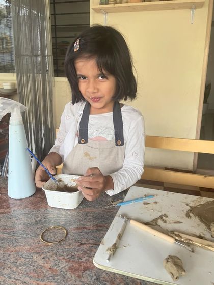 My daughter, my inspiration. Seeing her mix clay and paint with such curiosity reminds me of the pure, simple joy of creating.