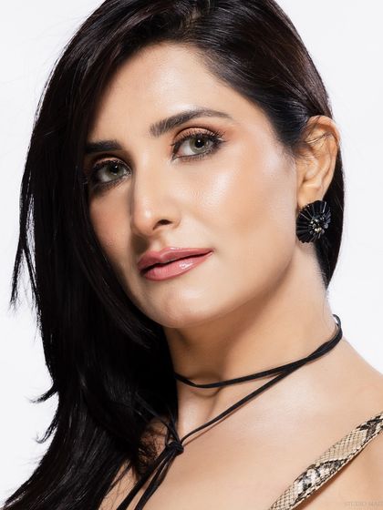 A classic beauty headshot, with a soft and engaging expression.