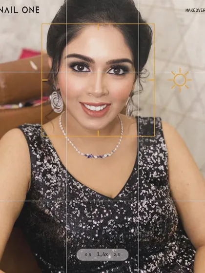 This is our signature party-ready look, perfect for an evening gala or a cocktail event. We created a captivating smokey eye, balanced with a sophisticated nude lip and a luminous skin finish. The result is pure glamour that ensures you are the center of attention.
