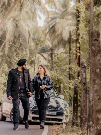 A candid shot of the couple walking hand-in-hand, with their convertible car in the background. This image feels like a still from a romantic road trip movie.
