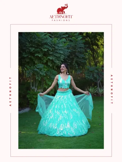 If mermaids had a wardrobe, this would be in it. This aqua georgette lehenga flows like ocean waves, with intricate leaf embroidery for a touch of nature's elegance.