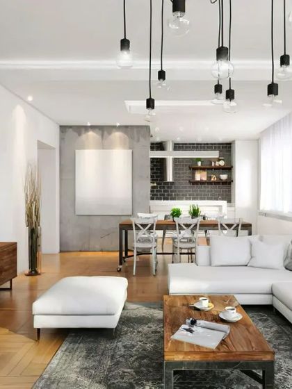 An industrial-style open-plan living space with a simple wooden media unit. The design blends raw elements like concrete walls with warm wood tones.