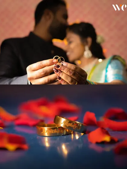 A creative shot showcasing the engagement rings. We love finding unique ways to photograph these important symbols, here focusing on the rings with the couple softly blurred in the background.