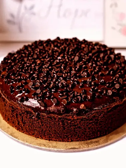 You can never have too much chocolate. This rich chocolate chip cake is covered in a glossy ganache and generously sprinkled with more chocolate chips for an intense flavor.