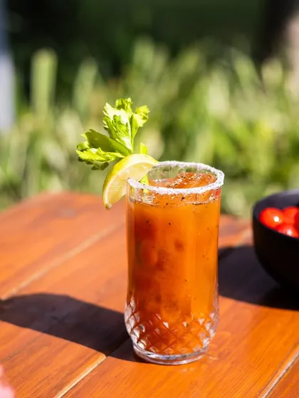My take on the iconic Bloody Mary, served with a salt rim and a fresh celery stalk. It’s a savory and zesty drink perfect for a weekend brunch in the garden.