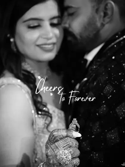 A timeless black and white shot focusing on the engagement ring. The bride's hand is in the foreground, symbolizing the promise of a future together.