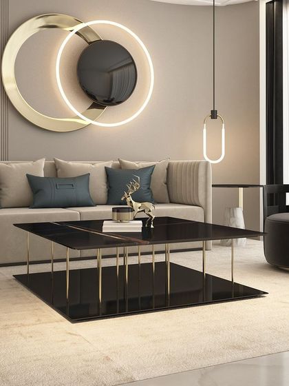Elevate your living room with our sleek and modern center table. Its two-tiered design with a black marble top and slim golden legs creates a perfect, airy focal point.