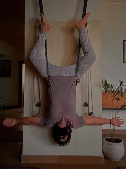 An inverted aerial pose that helps to lengthen the spine and improve blood circulation to the brain. For me, this is a form of devotion.